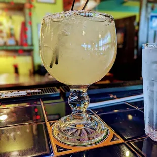 a glass of jalapeno on a bar