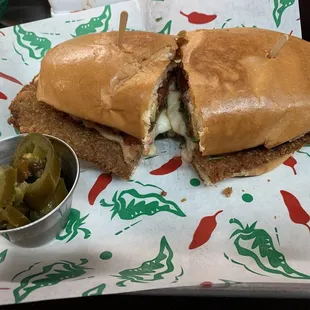 Pork star torta! Pork Milanese, cheese stuffed chile relleno, lettuce, pico, &amp; refried beans. The French bread was perfect.