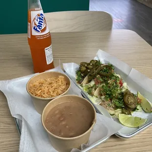 Corn tortilla tacos, beans &amp; rice with Fanta