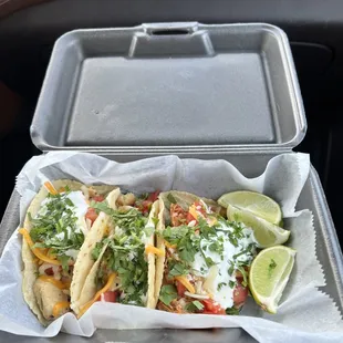 Chicken Tacos on Homemade Corn Tortillas. Love the fresh cilantro &amp; limes that come with it. Highly recommend the spicy shredded chicken