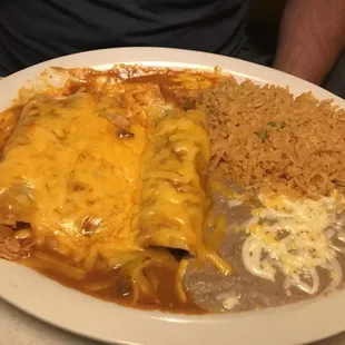 Chicken enchiladas with rice and beans