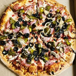 Create Your Own: Canadian bacon, black olives, onions, mushrooms and jalapeños