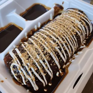 El Burrito, wet style with mole.