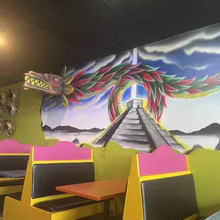 a colorful mural on the wall of a mexican restaurant