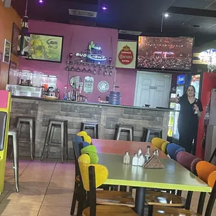 a woman standing in a restaurant