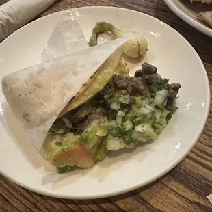 Carne asada super taco with guacamole