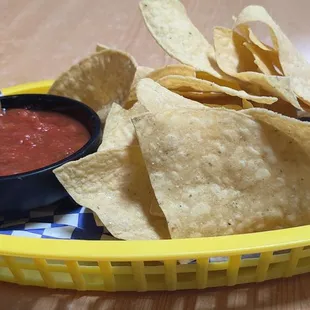 a basket of chips and salsa