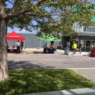 a large group of people standing in a parking lot