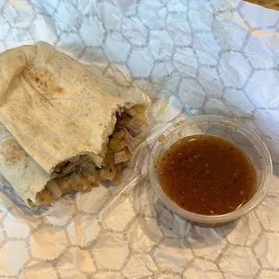 Carnitas burrito with red sauce  Sorry I ate most of it before I posted this lol