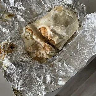 a burrito wrapped in tin foil