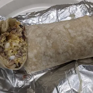 Breakfast burrito with carnitas... No flavor, bland!  Get Salsa!!