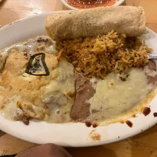 That triangle is the piece of Chili Relleno. Worthless!!  Nothing but cheese and beans!!!