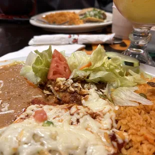 Enchilada dinner (roja, verde, and mole), with beans and rice