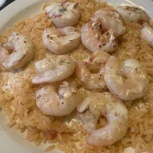 a plate of shrimp and rice