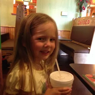 Shilo drinking in the colorful restaurant