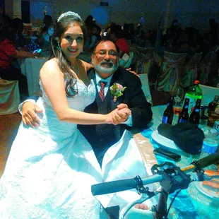 a bride and groom on a motorcycle