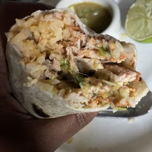 A burrito I made with all the separate items- carnitas, rice, beans, flour tortillas and salsa, all from Jalisco's.