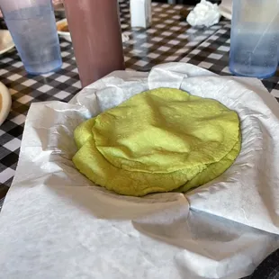 a green tortilla in a basket