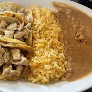 Chicken tacos with rice and beans