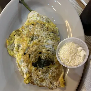 This is NOT a Chili Rellano!  And that is a nasty, dried out, yolk-busted, fried egg. Not sure my dog would eat that!