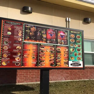 Sprawling but easy to read menu, with manicured grass for a background.