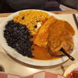 Rice, beansz enchilada and, chile relleno.