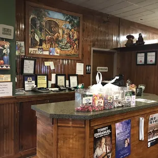 Register and bathrooms in front.