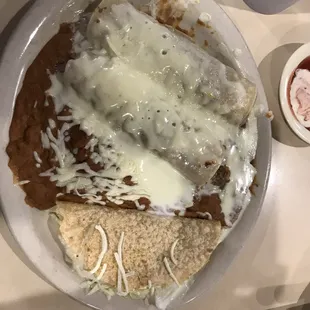 Combo #1, 2 each Ground Beef Enchiladas with Ground Beef Taco. Upgraded Red Sauce to Queso on top. Very tasty and filling!