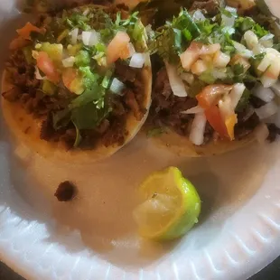 Carne asada and Pastor tacos