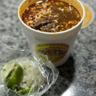 a cup of soup and a bowl of rice