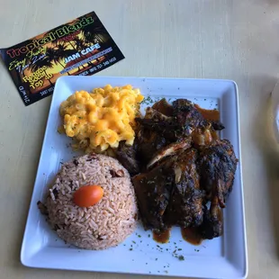 Jerk chicken, rice and peas, and Mac and cheese