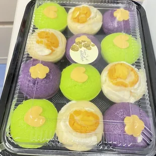 a tray of decorated cupcakes