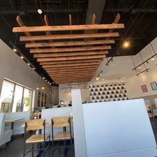 a dining area with tables and chairs
