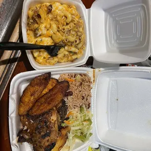 Rude boy jerk chicken with rich and peas cabbage plantain and Mac n cheese.