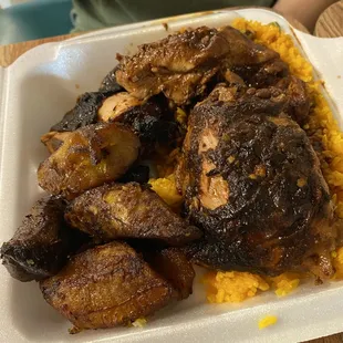 Jerk chicken lunch plate with yellow rice &amp; plantains