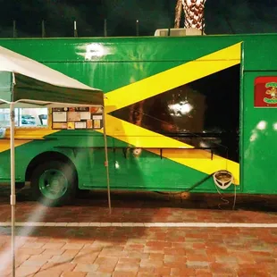 a jamaican flag painted on the side of the truck