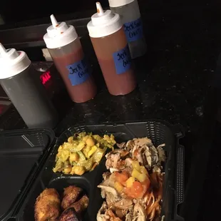 a tray of food and condiments