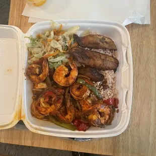 Jerk, shrimp, bean and rice, fried plantain and smothered cabbage