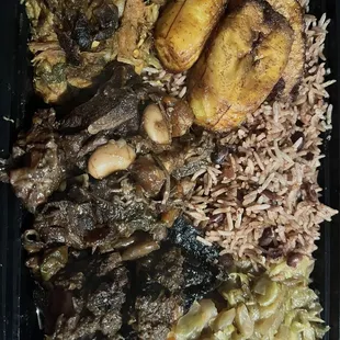 3-meat combination: jerk chicken, oxtails, brown stewed chicken, plantains, rice &amp; peas, cabbage.