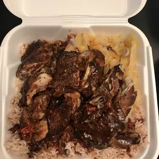 Jerk chicken (fall off the bone) w/ rice and steamed veggies (Size L, $12.50)