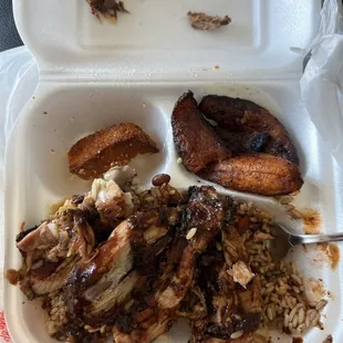 Jerk chicken, plantains, half eaten corn bread