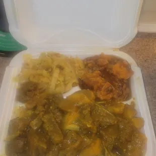 Half Curry goat &amp; half oxtail over rice w/candied yams and cabbage  So yummy
