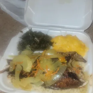 Red Snapper cooked &amp; seasoned to perfection over rice with collard greens and Macaroni