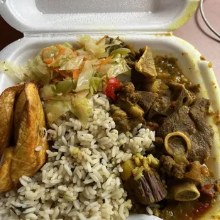 Curry goat with spinach rice