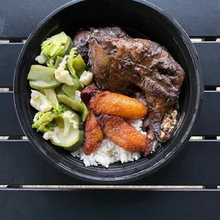 Jerk Chicken with plantains, plain rice, and steamed veggies.