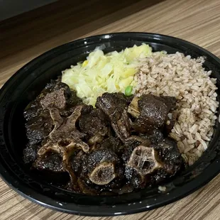 a plate of beef and rice