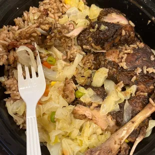 Large Jerk Chicken with steamed cabbage and rice and peas
