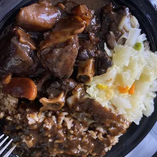 Oxtails rice and peas cabbage