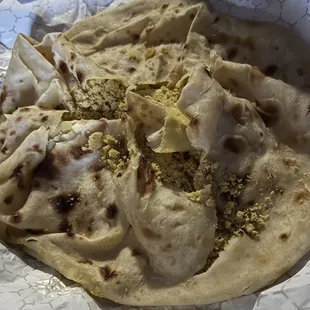 Where do you pay $10 for a vegetable roti with no vegetables??? Curry powder and naan bread