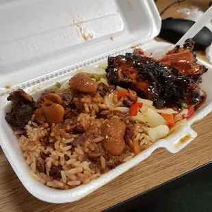 Lunch special jerk chicken with ox tail sauce